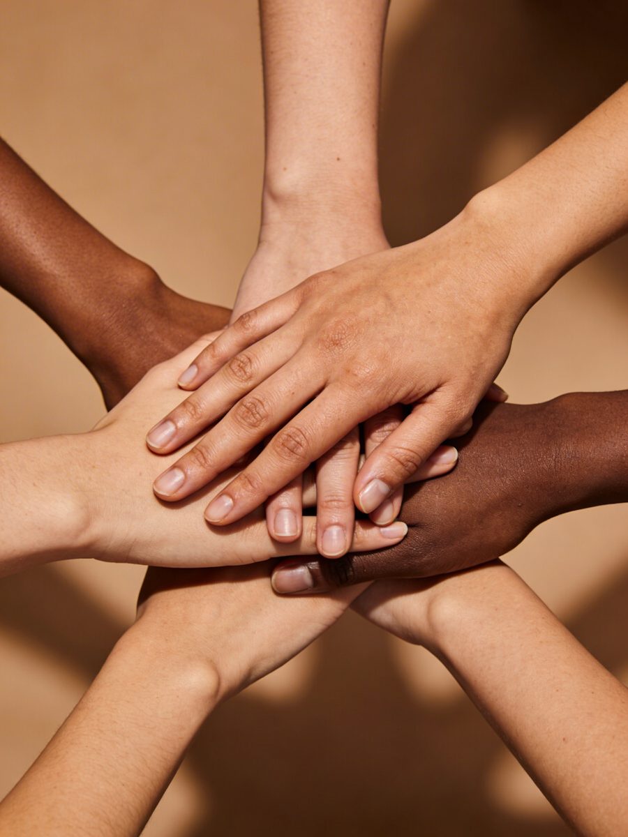 Hands stacked together to show unity