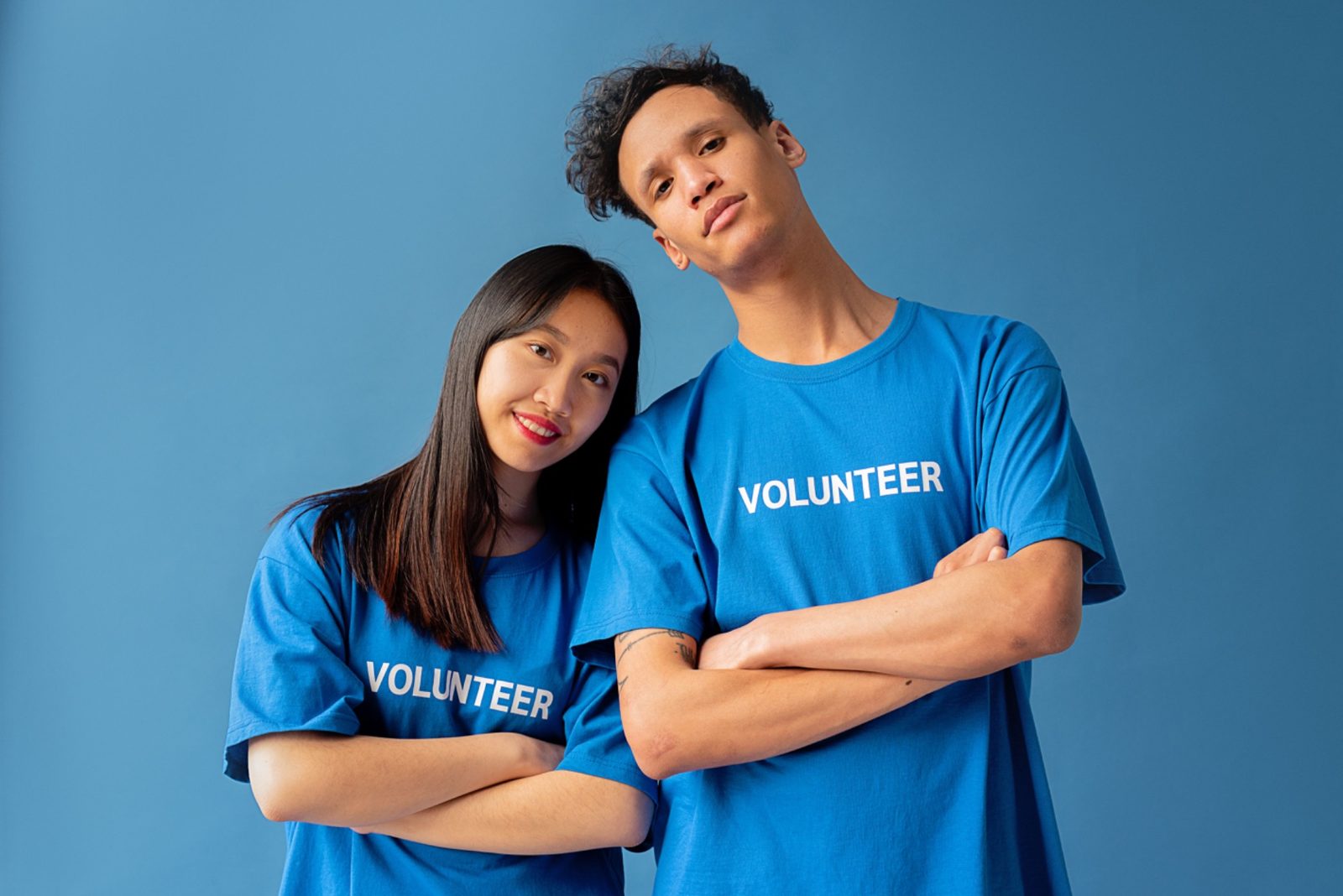 Two volunteers standing together